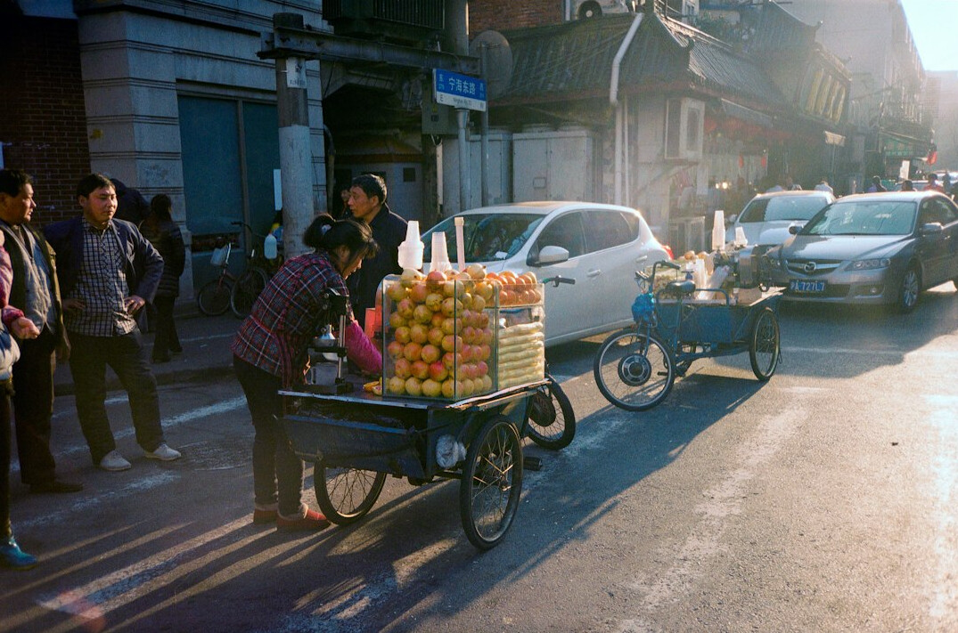 Chilean street vendor selling fruit from a cart