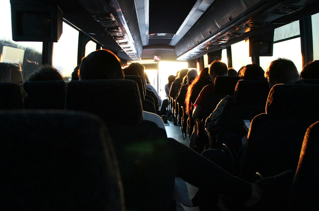 Crowded city bus interior with passengers