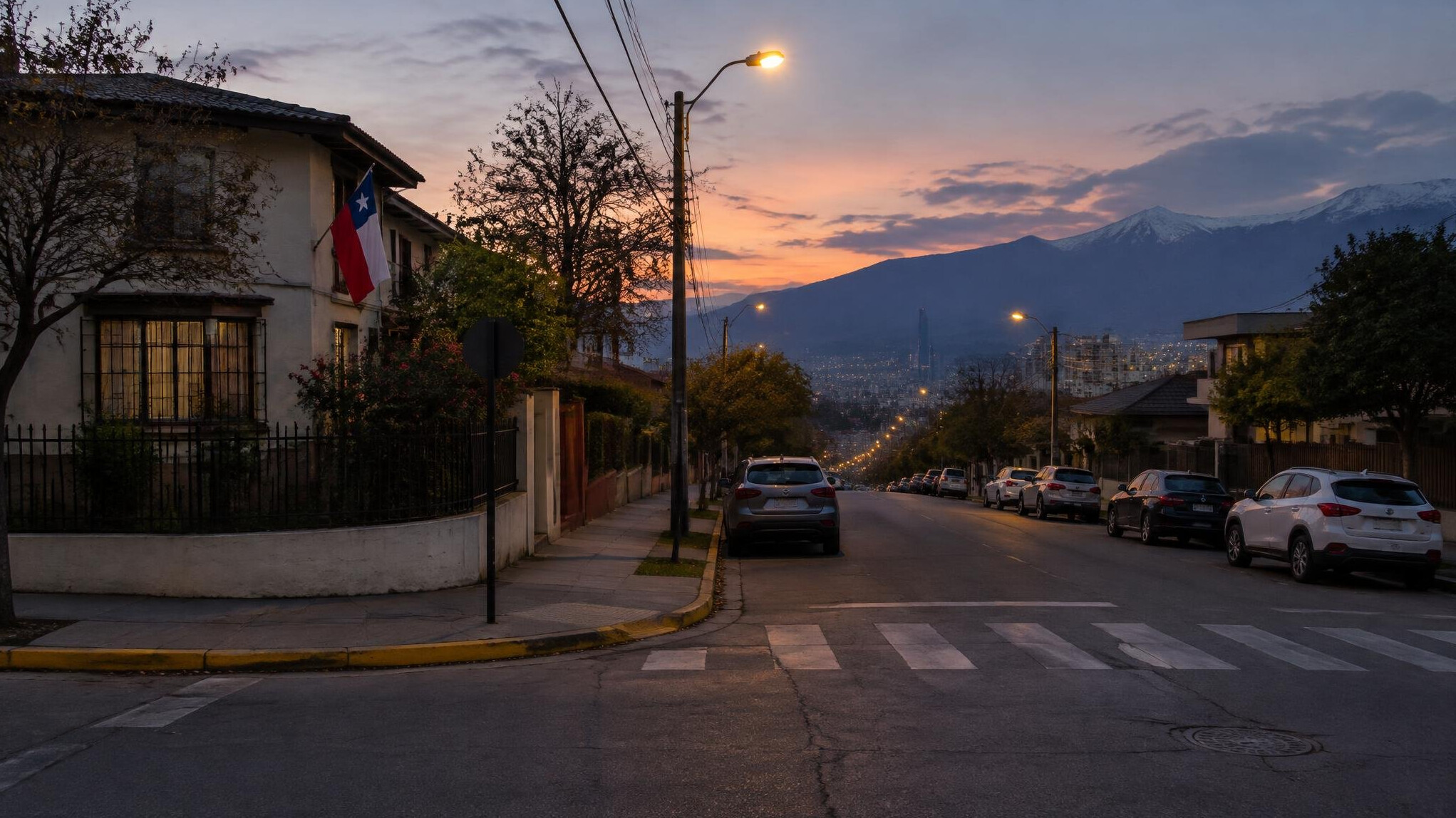 Quiet residential street corner in a Chilean city at dusk